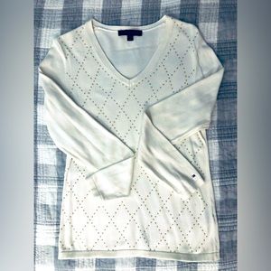 Tommy Hilfiger white sweater with gold metal embellishment. V-neck.